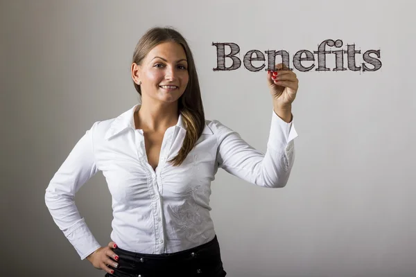 Benefits - Beautiful girl writing on transparent surface — Stock Photo, Image