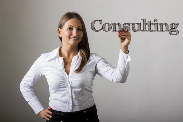 Consulting - Beautiful girl writing on transparent surface — Stock Photo, Image