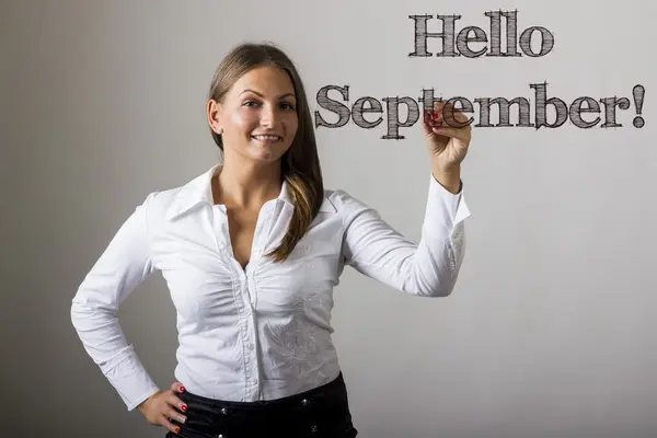 Ciao settembre! - Bella ragazza che scrive su superficie trasparente — Foto Stock