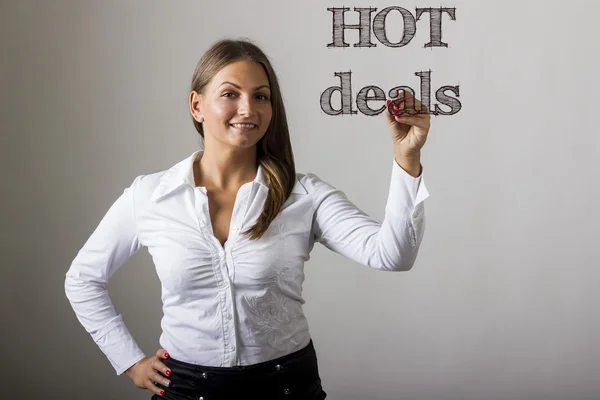 Hot Deals - mooi meisje schrijven op transparante oppervlak — Stockfoto