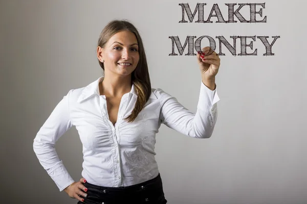 Make money - schöne Mädchen schreiben auf transparenter Oberfläche — Stockfoto