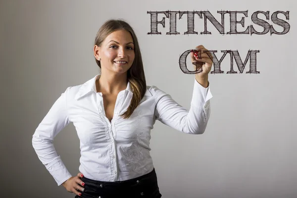 Fitness Gym - vacker flicka skriver på transparent yta — Stockfoto