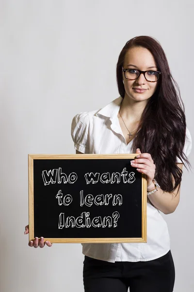 Who wants to learn Indian? - Young businesswoman holding chalkbo — Stock Photo, Image