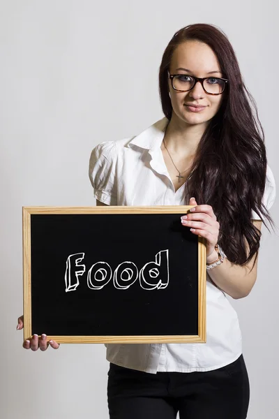 Продукты питания - Молодая предпринимательница держит доску — стоковое фото