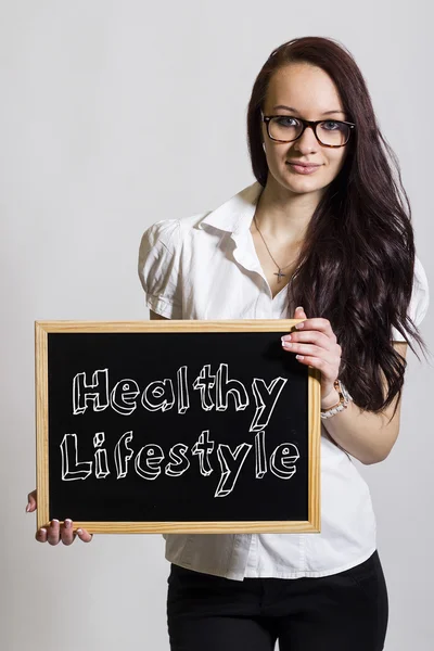 Zdrowy styl życia - młody bizneswoman gospodarstwa chalkboard — Zdjęcie stockowe