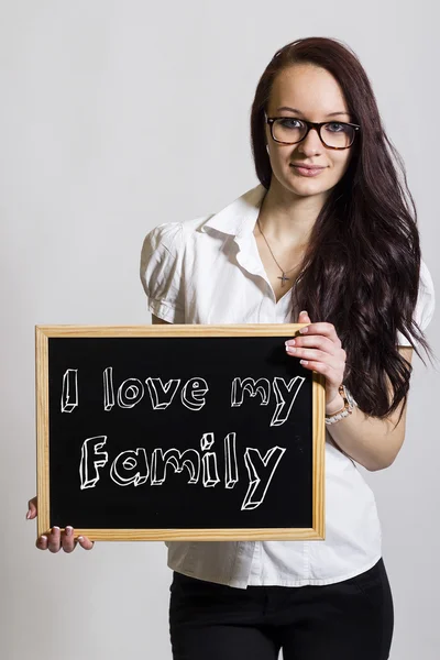 Ich liebe meine familie - junge unternehmerin mit kreidetafel — Stockfoto