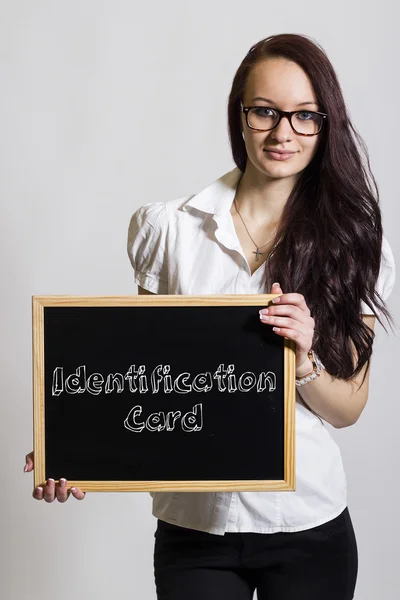 Identification Card - Young businesswoman holding chalkboard — Stock Photo, Image