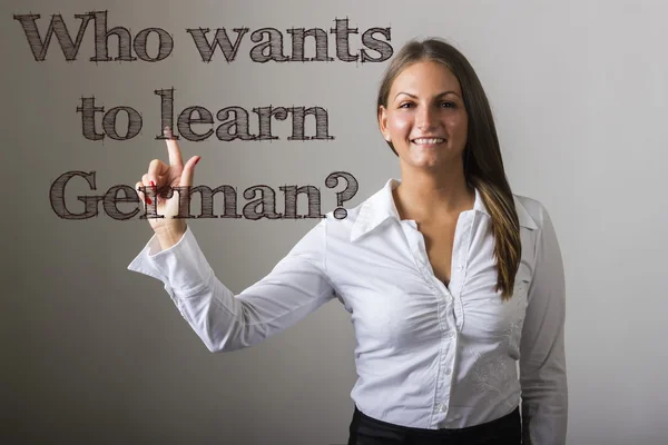 Who wants to learn German? - Beautiful girl touching text on tra — Stock Photo, Image