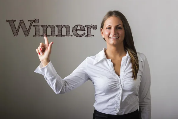 Vítěz - krásná dívka se dotýká text na průhledné plochy — Stock fotografie