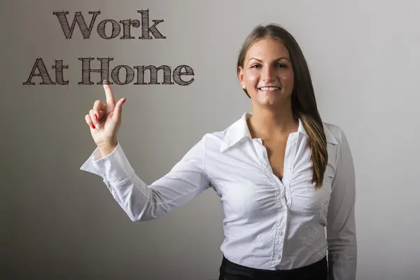 Work At Home - Beautiful girl touching text on transparent surfa — Stock Photo, Image