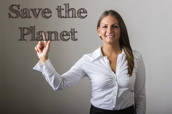 Save the Planet - девушка, трогающая текст на прозрачной бумаге — стоковое фото