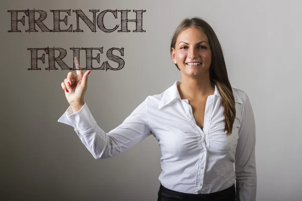 FRENCH FRIES - Beautiful girl touching text on transparent surfa — Stockfoto