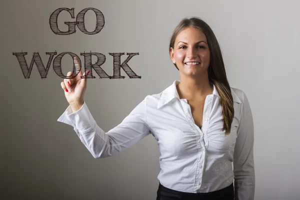 GO WORK - Beautiful girl touching text on transparent surface — Stockfoto