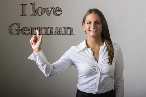 I love german - schönes Mädchen, das Text auf transparenter Brandung berührt — Stockfoto
