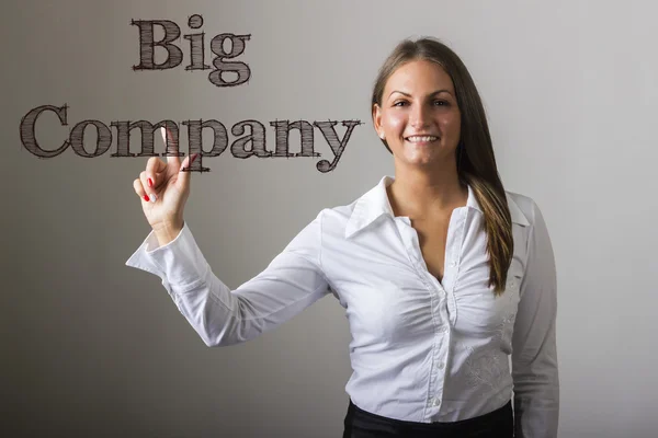 Big Company - schöne Mädchen berühren Text auf transparentem Surfac — Stockfoto