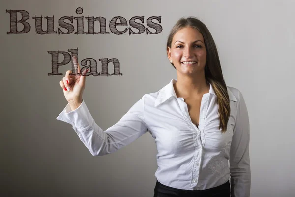 Business Plan - Beautiful girl touching text on transparent surf — Stock Photo, Image