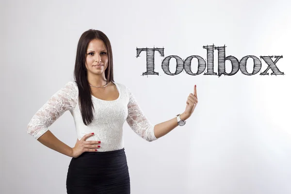 Toolbox - mooie zakenvrouw wijzen — Stockfoto