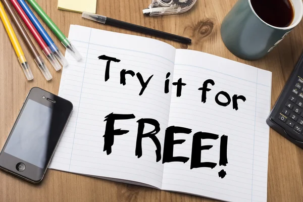 Try it for FREE! - Note Pad With Text On Wooden Table