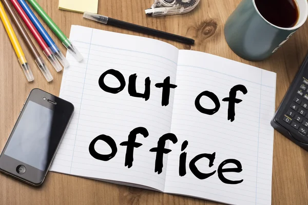 Out of office - Note Pad With Text On Wooden Table — Stock Photo, Image