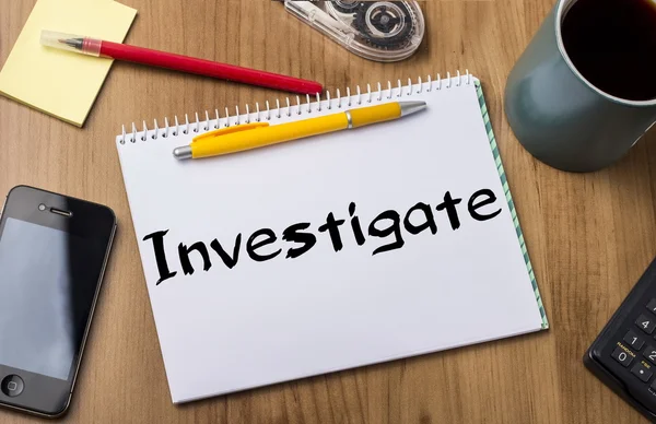 Investigate - Note Pad With Text On Wooden Table — Stock Photo, Image