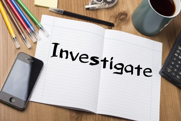 Investigate - Note Pad With Text On Wooden Table — Stock Photo, Image