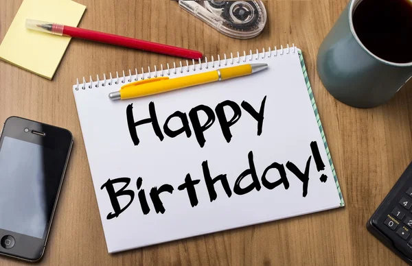 Happy Birthday! - Note Pad With Text On Wooden Table