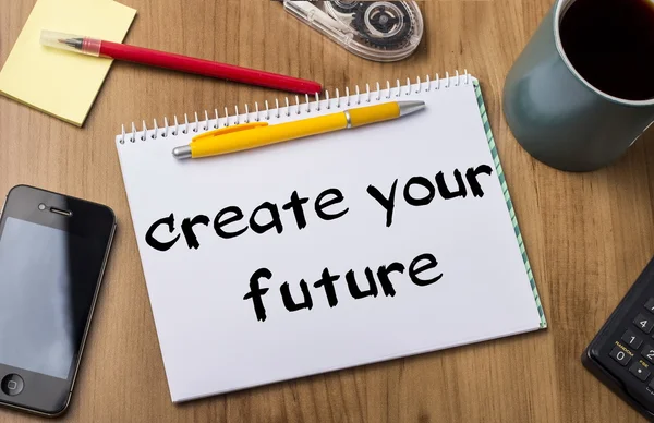 Skapa din framtid - Note Pad med Text på träbord — Stockfoto