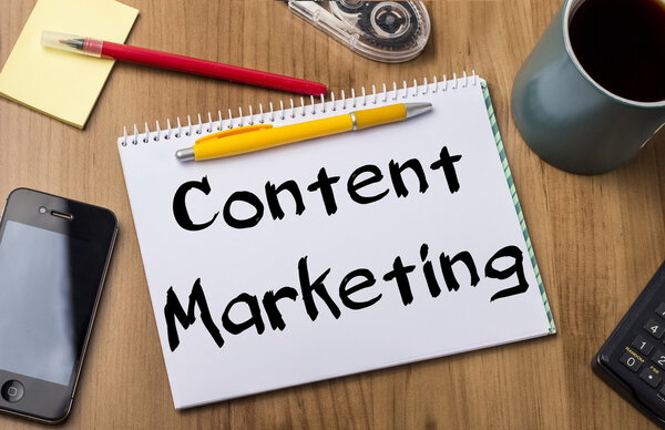 Content Marketing - Note Pad With Text On Wooden Table