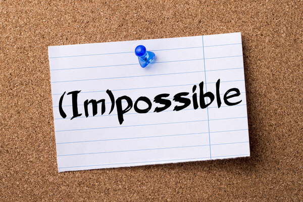 (Im)possible - teared note paper  pinned on bulletin board