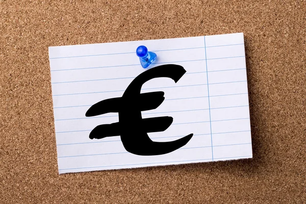 Euro sign - teared note paper  pinned on bulletin board