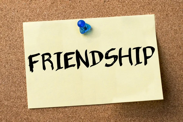 FRIENDSHIP - adhesive label pinned on bulletin board — Stock Photo, Image