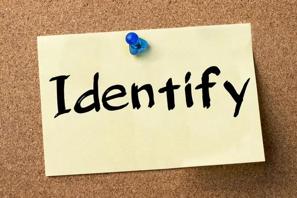 Identify - adhesive label pinned on bulletin board — Stock Photo, Image