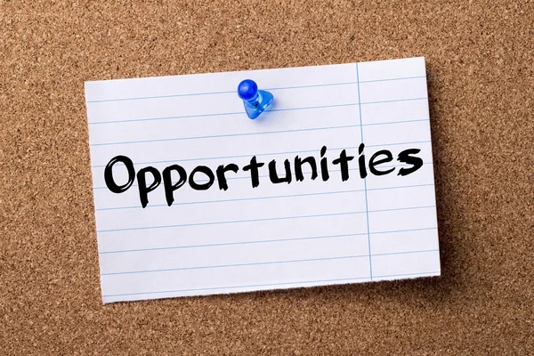 Opportunities - teared note paper  pinned on bulletin board — Stock Photo, Image