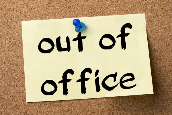 Out of office - adhesive label pinned on bulletin board — Stock Photo, Image