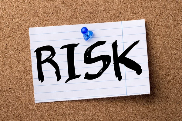 RISK - teared note paper  pinned on bulletin board — Stock Photo, Image