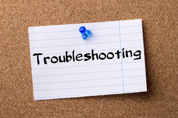 Troubleshooting - teared note paper  pinned on bulletin board — Stock Photo, Image