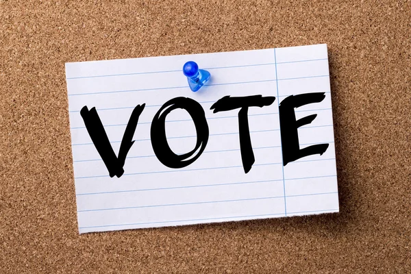 VOTE - teared note paper  pinned on bulletin board — Stock Photo, Image