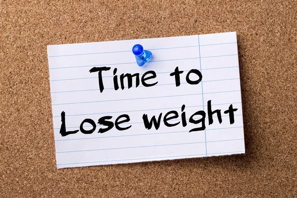 Time to Lose weight - teared note paper pinned on bulletin board
