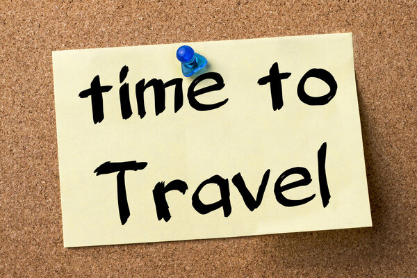 Time to Travel - adhesive label pinned on bulletin board - horizontal image