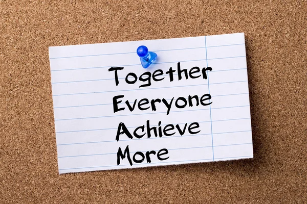 Together Everyone Achieve More TEAM - teared note paper pinned o