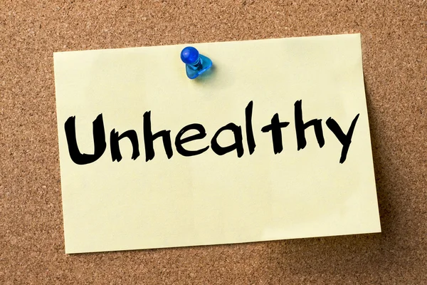 Unhealthy - adhesive label pinned on bulletin board