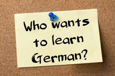 Who wants to learn German? - adhesive label pinned on bulletin b