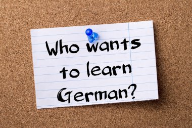 Who wants to learn German? - teared note paper pinned on bulleti