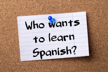 Who wants to learn Spanish? - teared note paper pinned on bullet