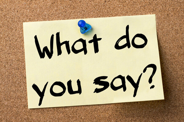 Ну, что скажешь? - клеевая этикетка, закрепленная на доске объявлений
