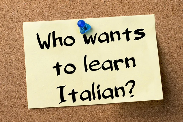 Who wants to learn Italian? - adhesive label pinned on bulletin — стокове фото
