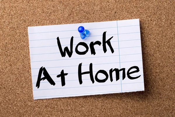 Work At Home - teared note paper pinned on bulletin board — Stock Photo, Image