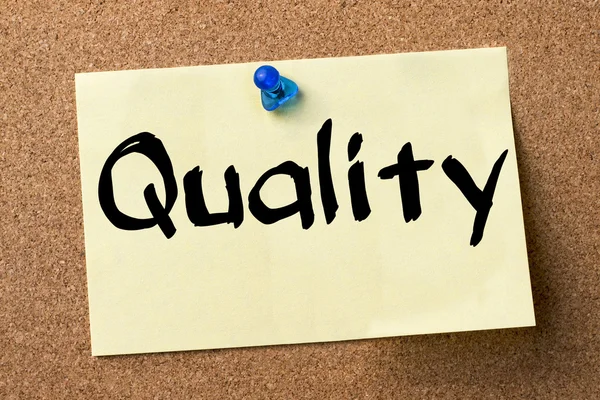 Quality - adhesive label pinned on bulletin board — Stock Photo, Image