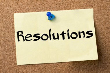 Kararları - yapışkanlı etiket bulletin board tutturulmuş.