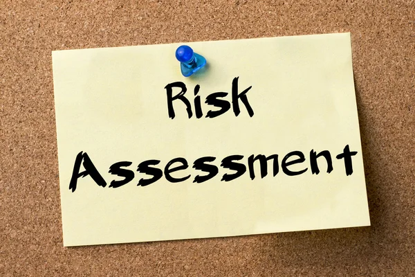 Risk Assessment - adhesive label pinned on bulletin board